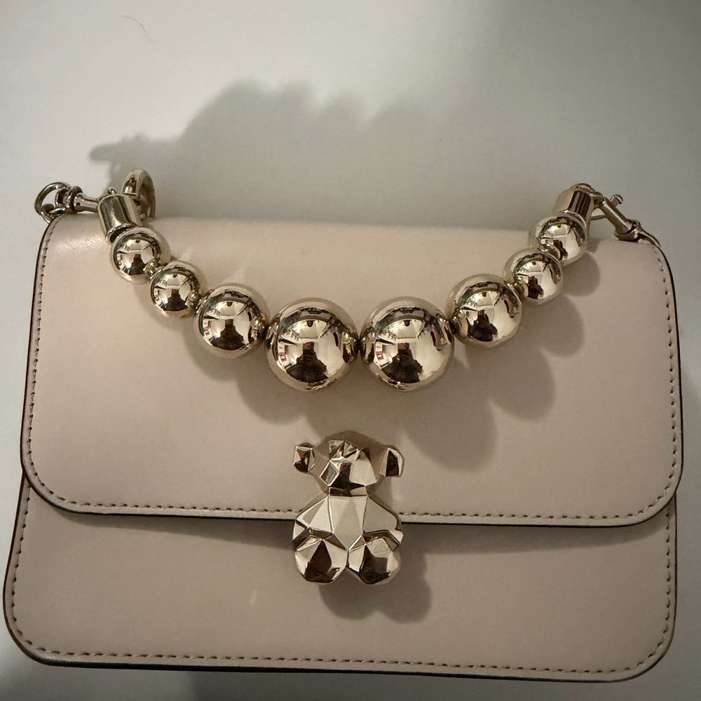 Tous authentic Elegant Cream Handbag with Gold Accents.